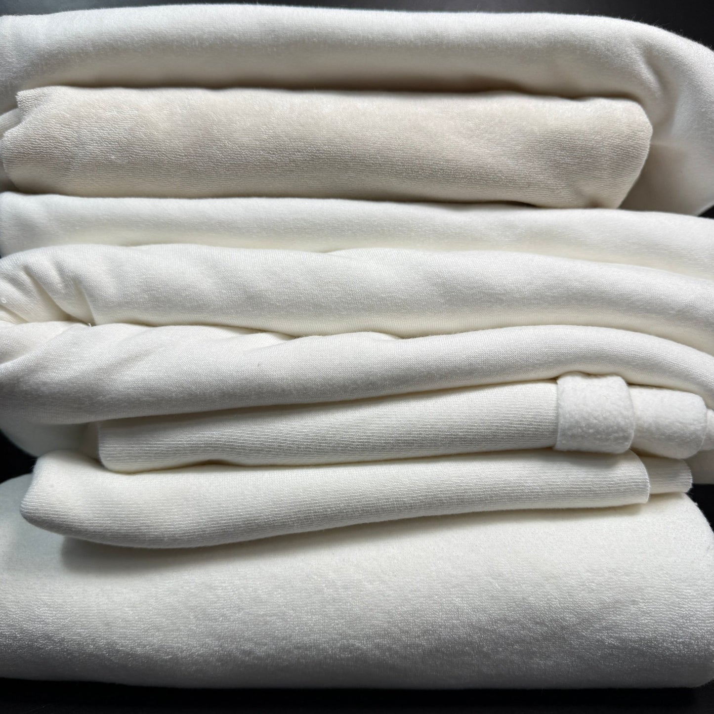 SALE BOX 1811F by Sale Box featuring various fabric samples including bamboo baby fabric, winter white baby fabric, medium USA fleece, and OC baby fabric, perfect for trying out quality materials.